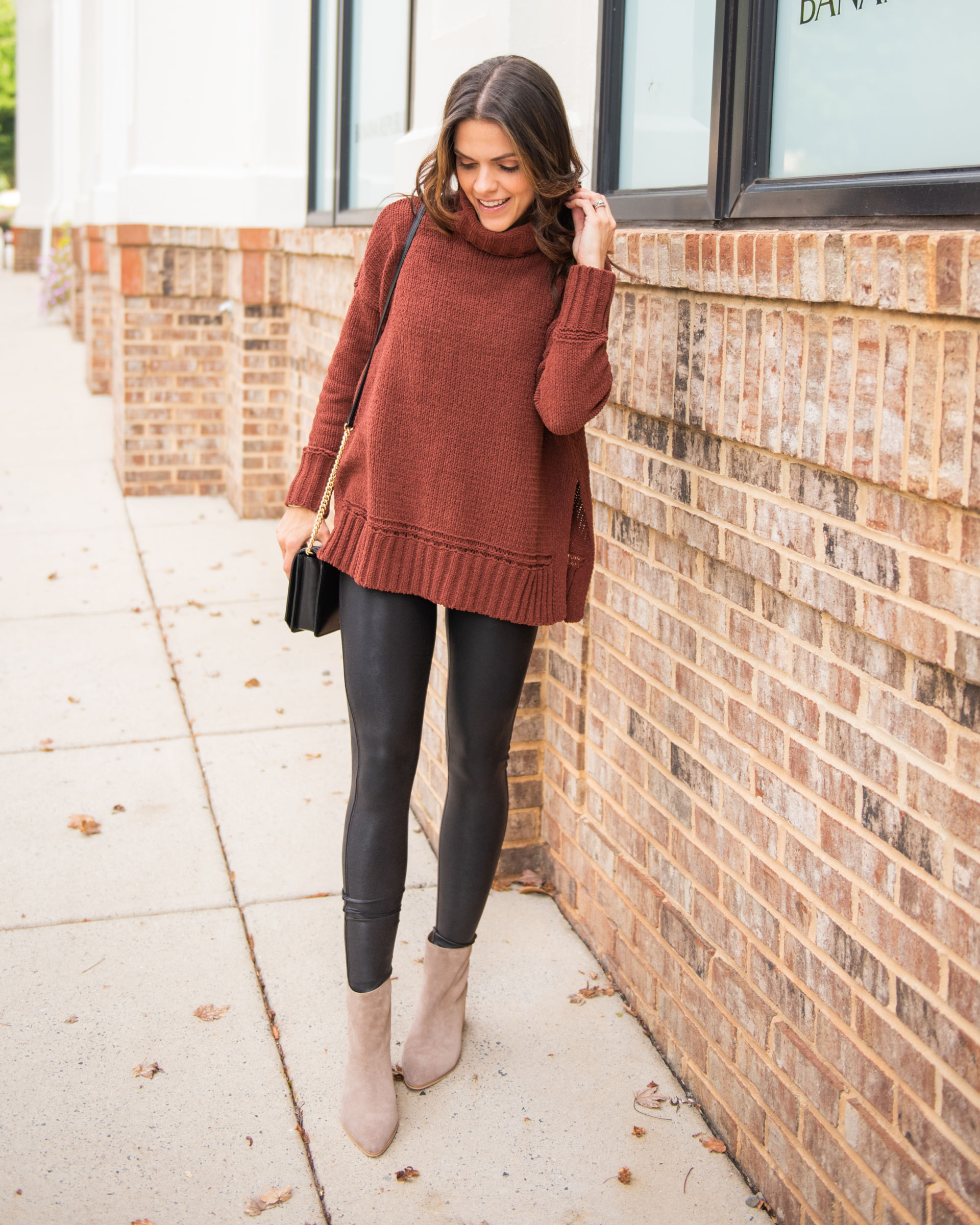tunic sweater with black Spanx leggings and printed booties
